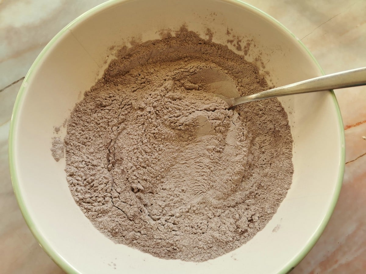 Soft wheat flour and cocoa powder mixed together in large bowl.
