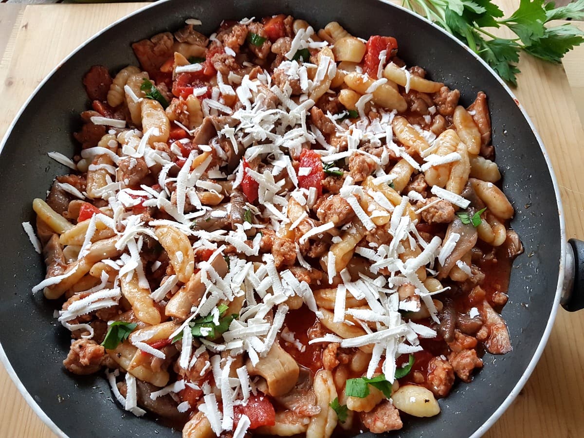 Homemade cavatelli pasta with oyster mushrooms and sausage.