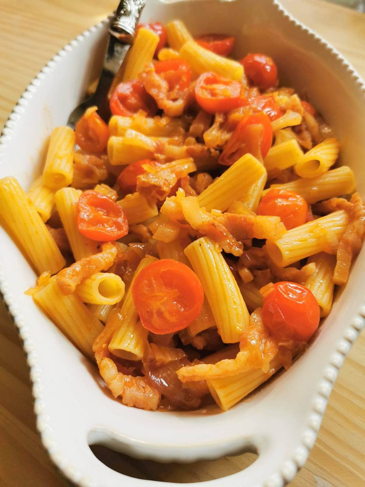 Rigatoni pasta with shallots and guanciale.