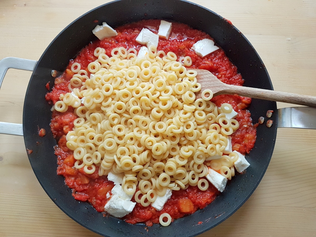 Cooked pasta added to the tomato and eggplant sauce.