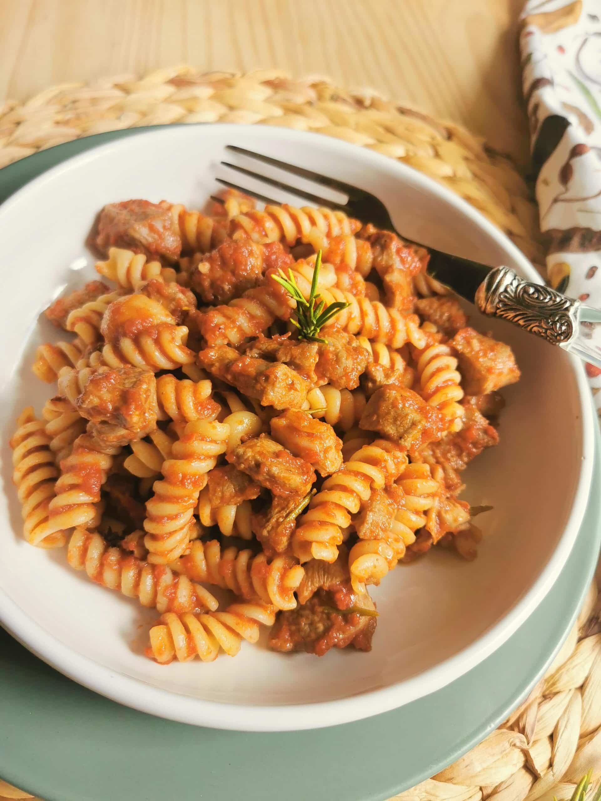 Lamb ragu (lamb sugo) with pasta in a bowl.