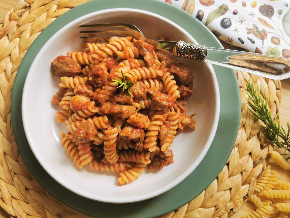 Lamb ragu with pasta in a bowl.