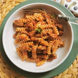 Lamb ragu with pasta in a bowl.