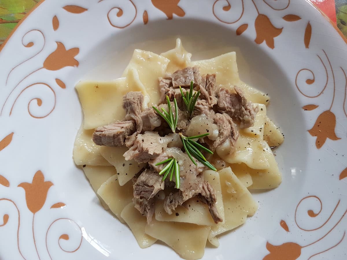 Braised veal and onion maltagliati pasta recipe from Sicily.