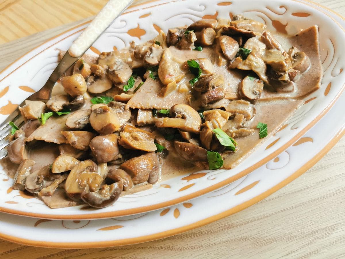 Chestnut maltagliati pasta with mushrooms.