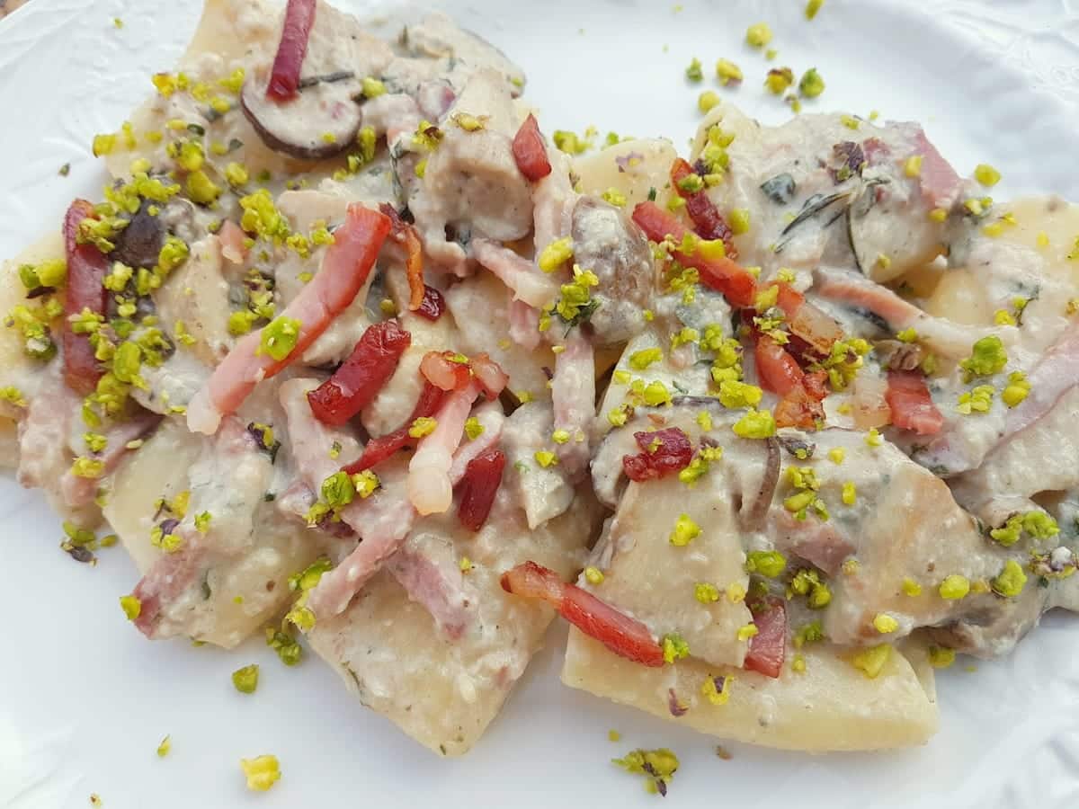 Paccheri with porcini, speck and pistachio.