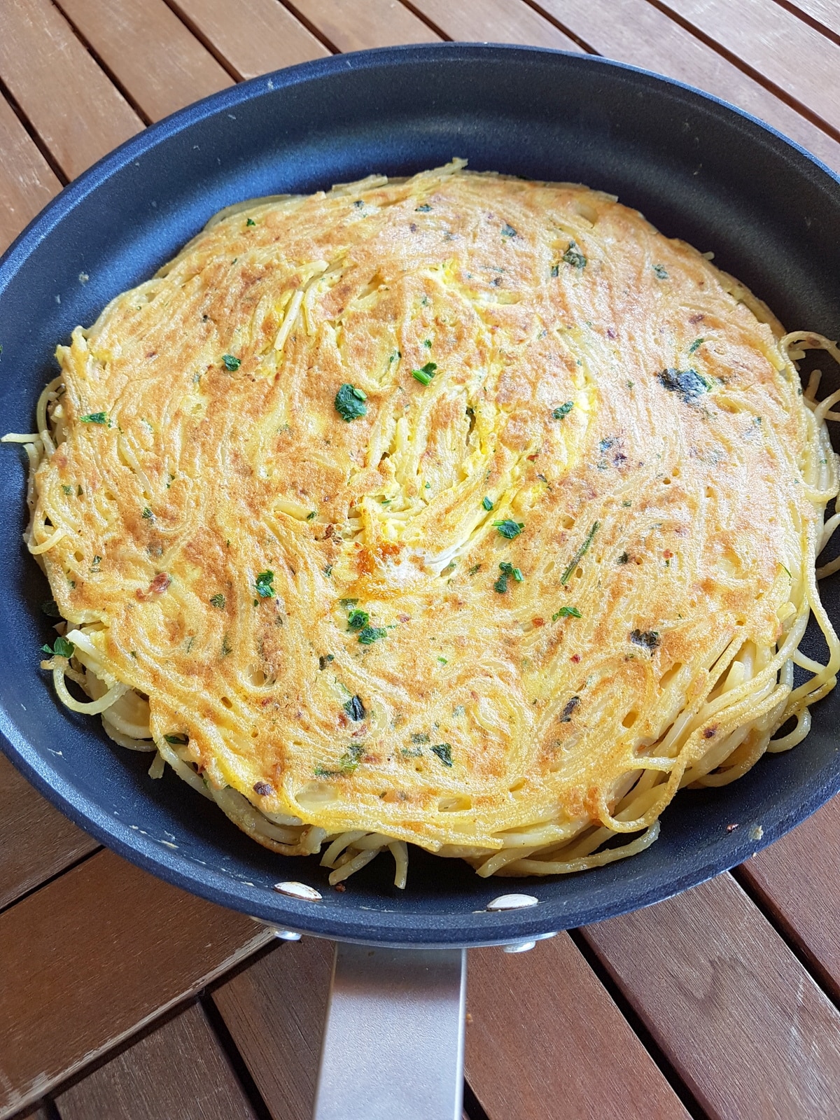 Pasta frittata in a pan.