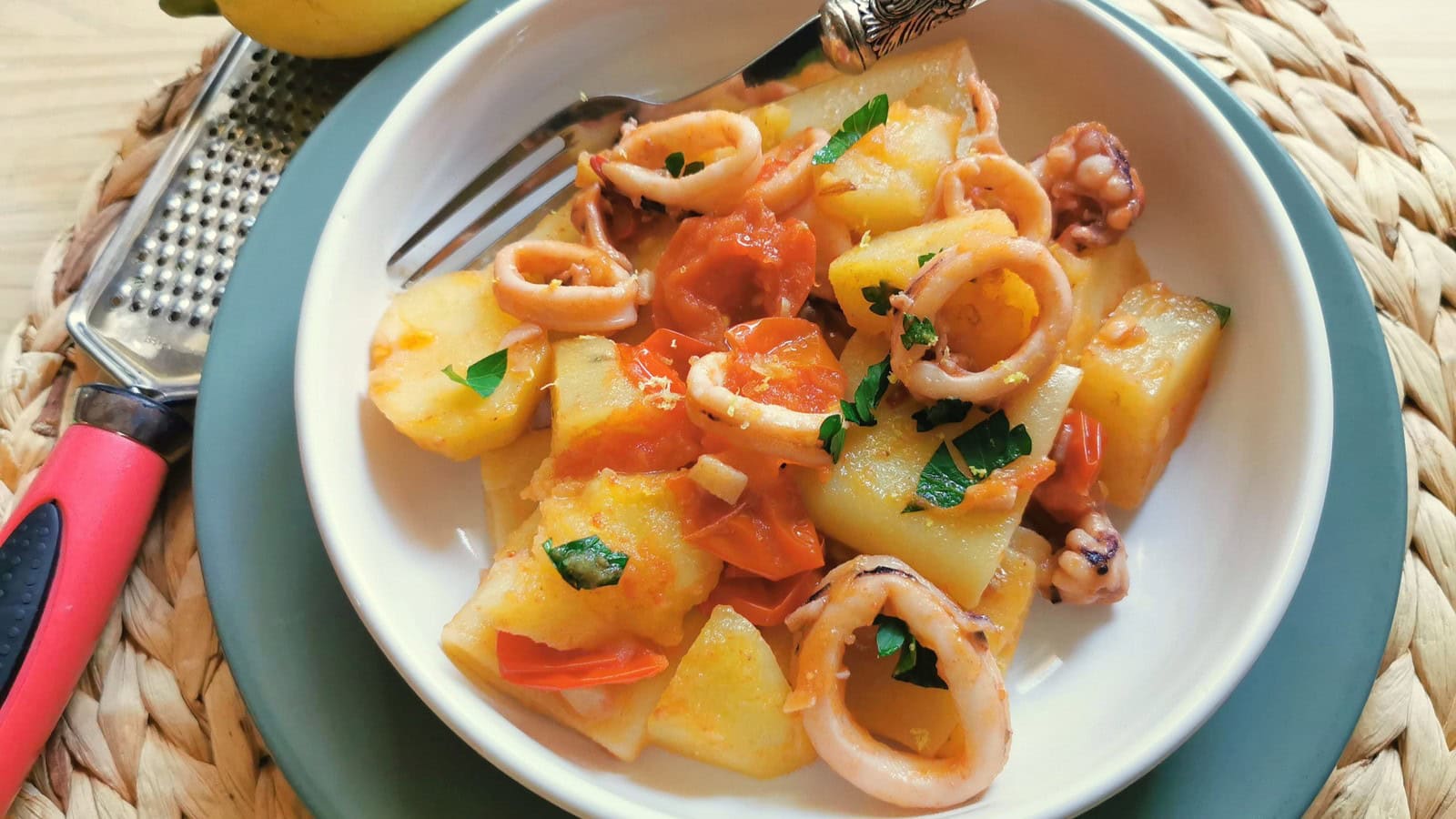 Calamari (squid) with pasta and sauce in a bowl.